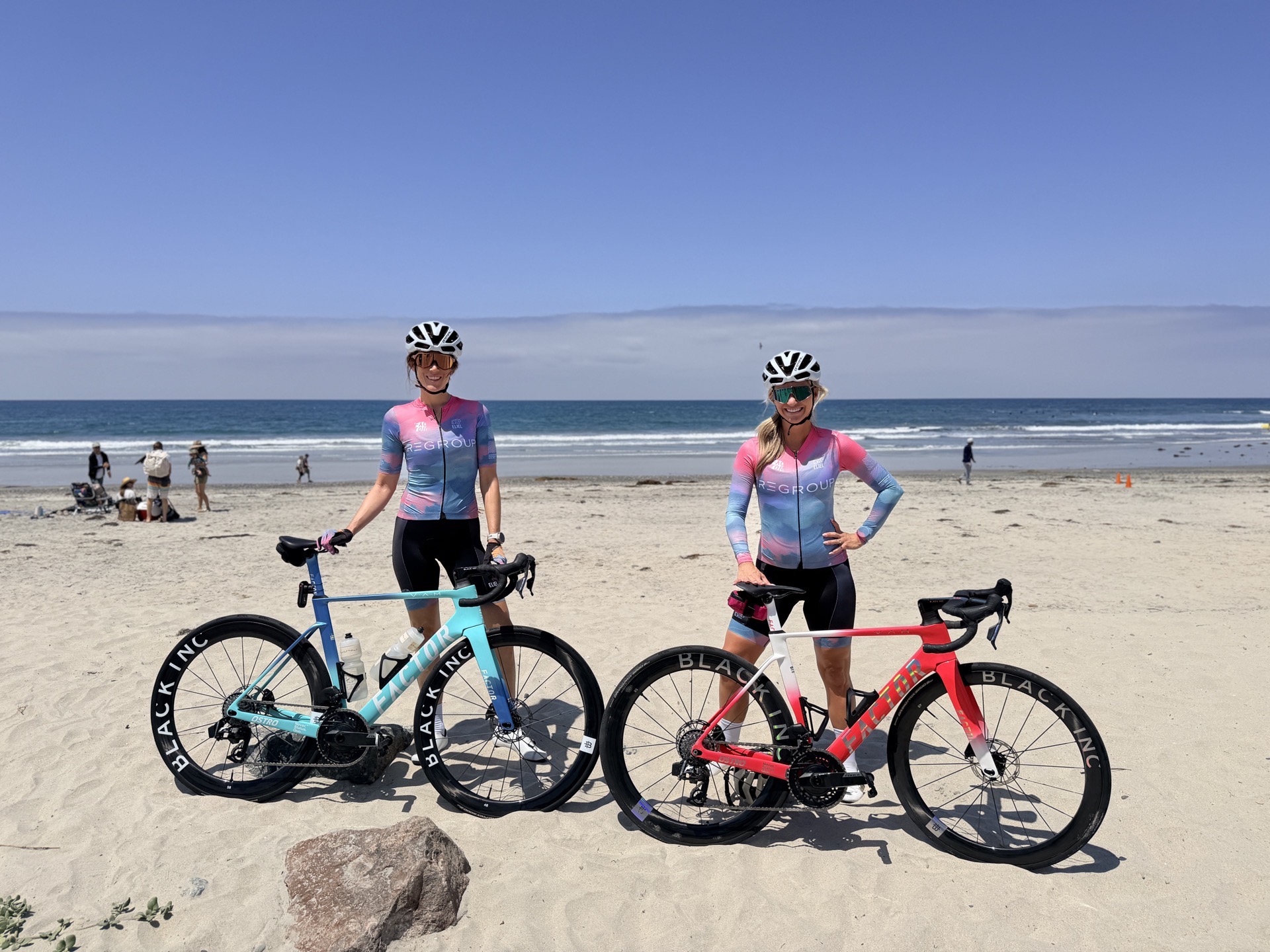 Chelsea and Lindsay showing off their Factor bikes at the beach